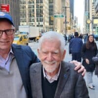 iPosi CEO Rich Lee (left) holds The Brick, the first cellphone invented by Engineer Marty Cooper (right), celebrating together in Chicago the April 3rd 50th anniversary of the first cellphone call.